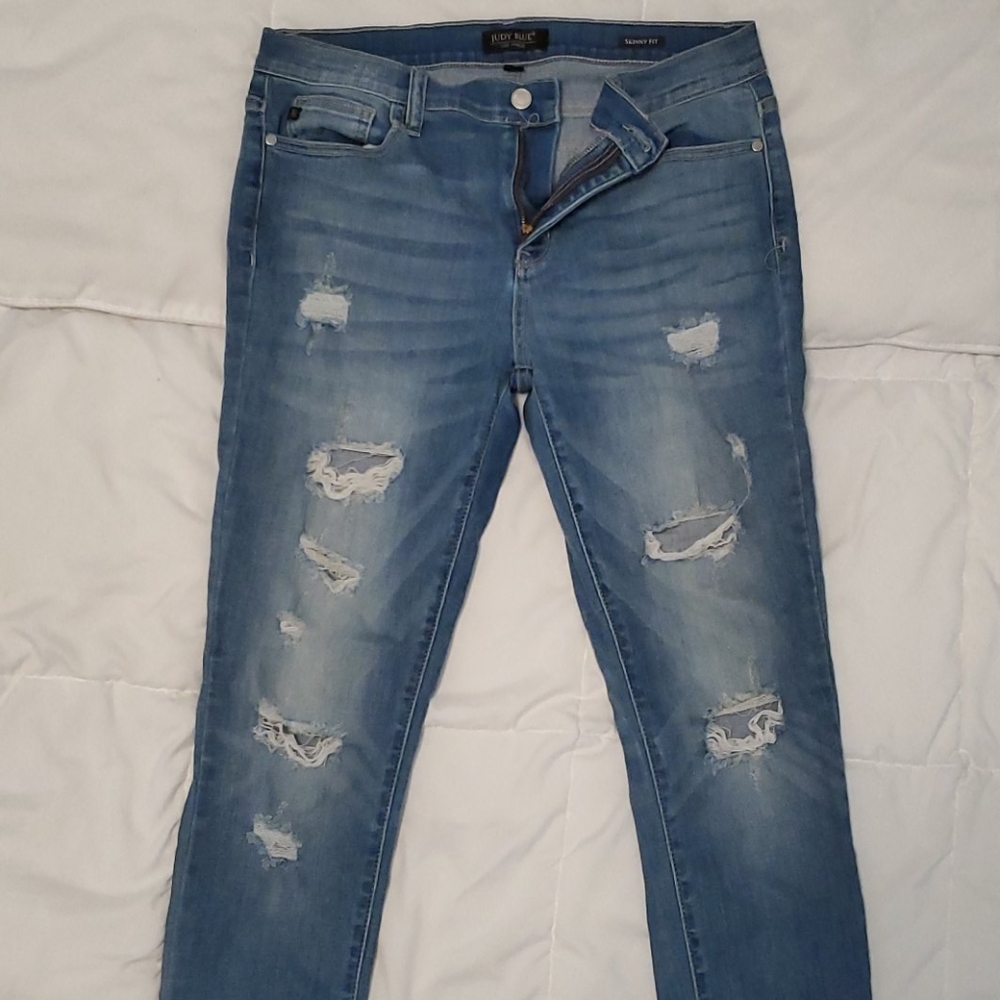 Ripped, distressed jeans.